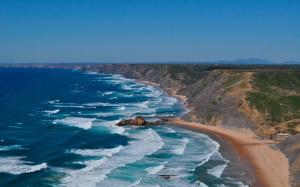 zon zee strand vlakbij vila do bispo algarve vakantie